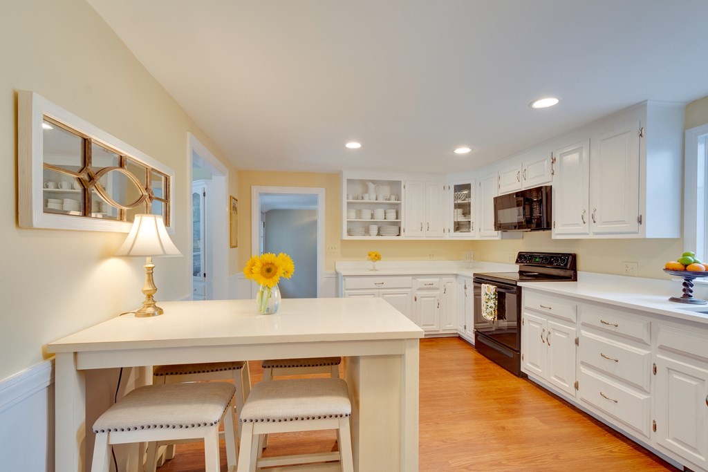 64 Grosvenor Road Needham, MA 02492 - Photo 13 of 36 a kitchen with a sink cabinets and window