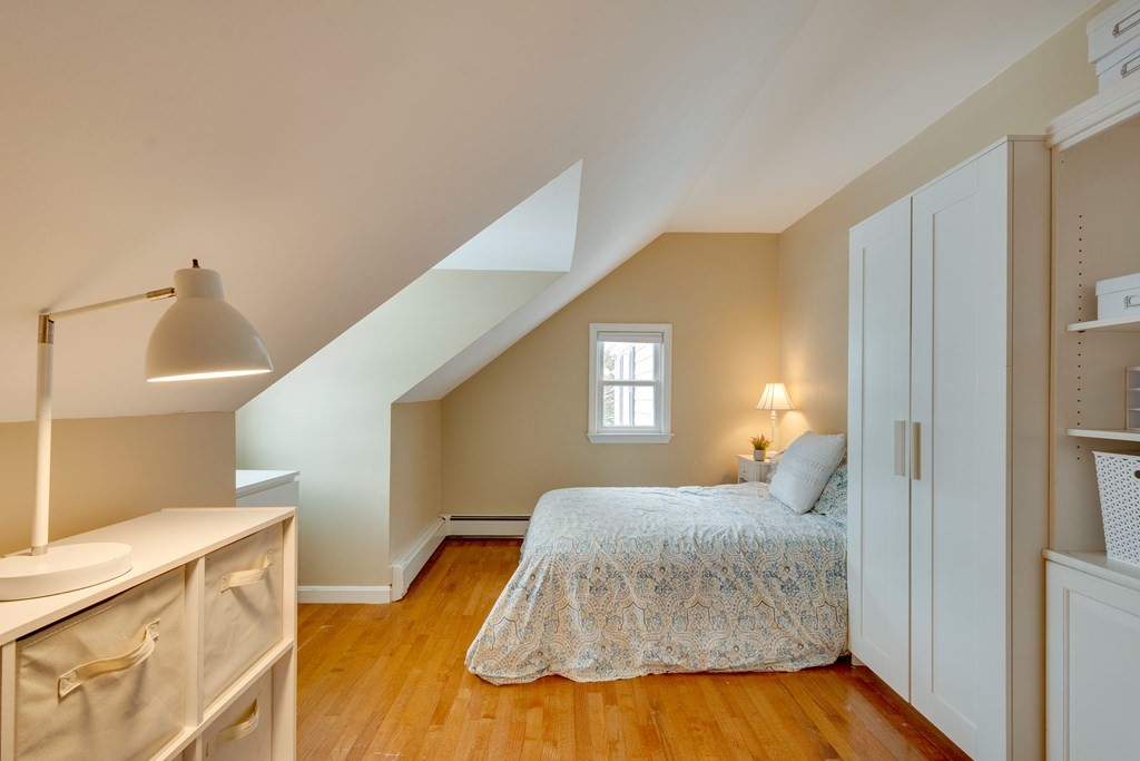64 Grosvenor Road Needham, MA 02492 - Photo 23 of 36 a bedroom with a bed and a window