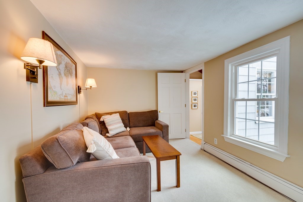 64 Grosvenor Road Needham, MA 02492 - Photo 24 of 36 a living room with furniture and a window