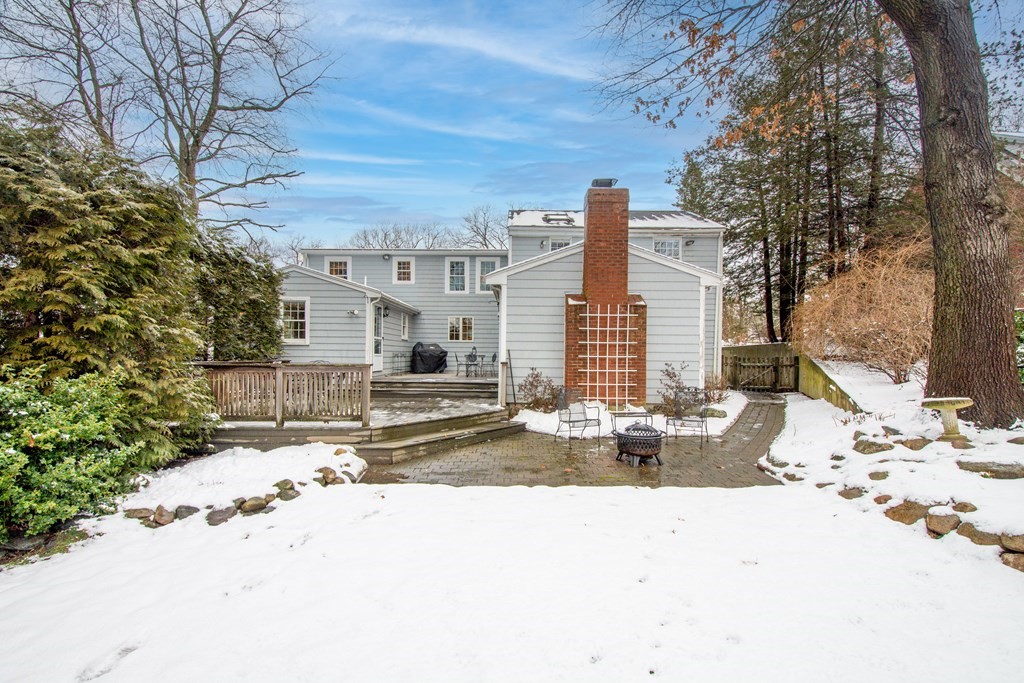 64 Grosvenor Road Needham, MA 02492 - Photo 35 of 36 a view of the house with snow on the road