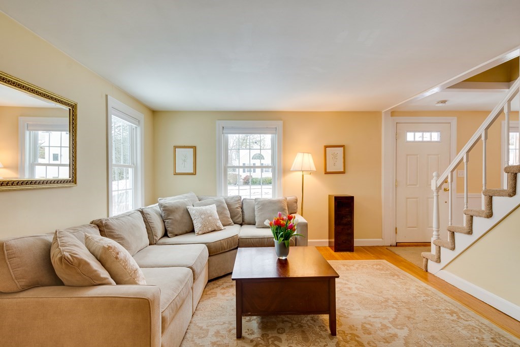 64 Grosvenor Road Needham, MA 02492 - Photo 6 of 36 a living room with furniture and a fireplace