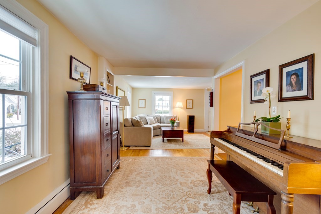 64 Grosvenor Road Needham, MA 02492 - Photo 8 of 36 a living room with furniture fireplace and a window