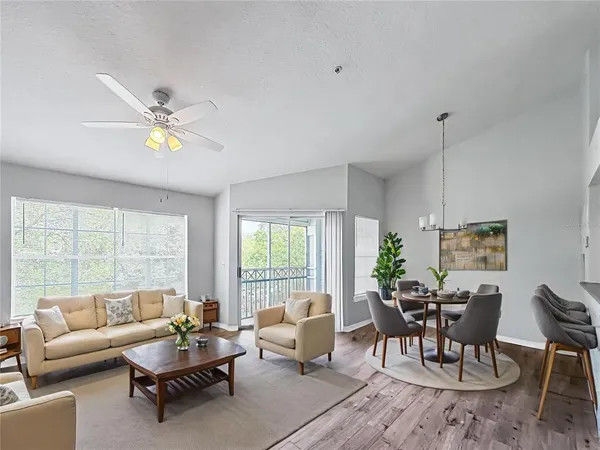 a living room with furniture and a large window