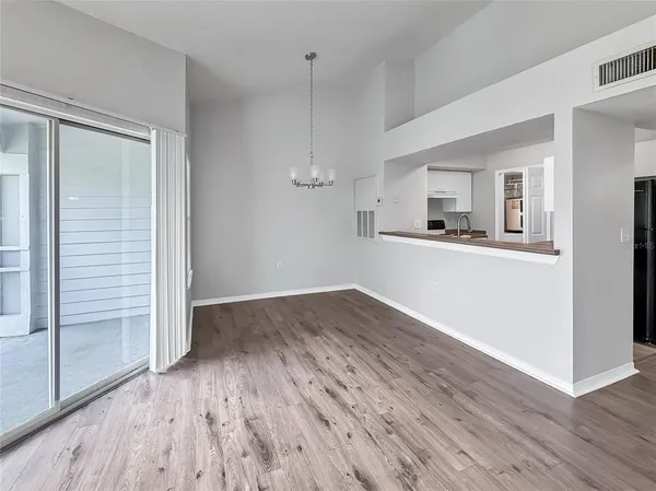 a view of a kitchen from the hallway