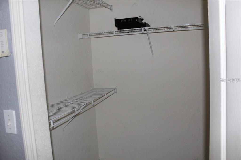 5017 City Street, Unit 1933 Orlando, FL 32839 - Photo 8 of 12 a view of a room with racks on the wall