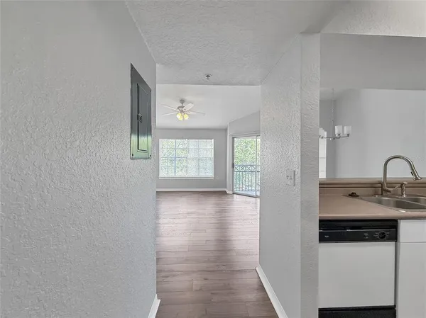 a view of a kitchen from the hallway