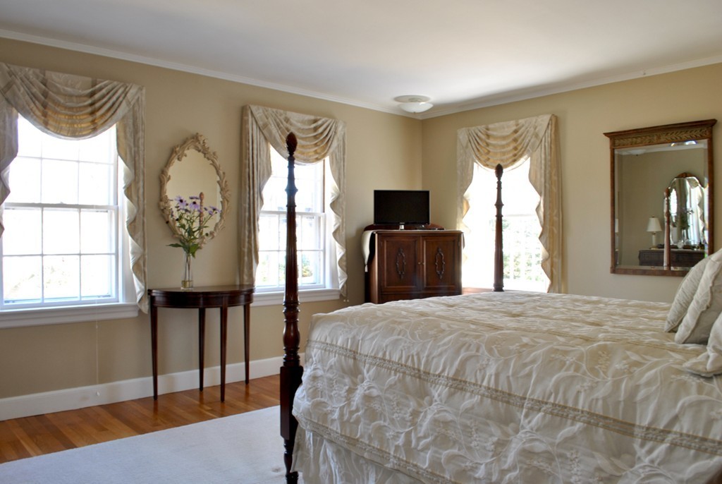 119 Crescent Road Concord, MA 01742 - Photo 14 of 18 a bedroom with a bed a dresser next to a window
