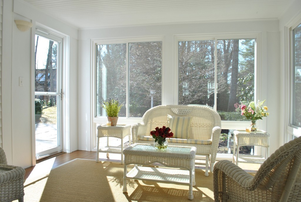 119 Crescent Road Concord, MA 01742 - Photo 17 of 18 a living room with a large window and dining table