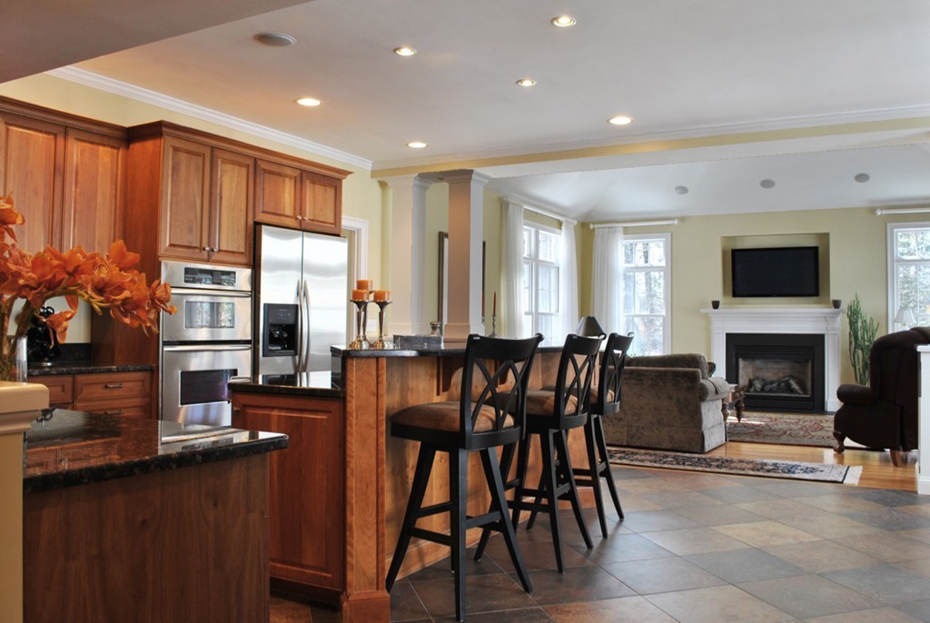 119 Crescent Road Concord, MA 01742 - Photo 3 of 18 a open kitchen with stainless steel appliances granite countertop a table and chairs