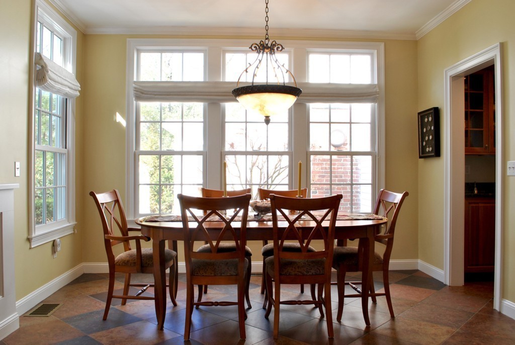 119 Crescent Road Concord, MA 01742 - Photo 6 of 18 a view of a dining room with furniture and windows
