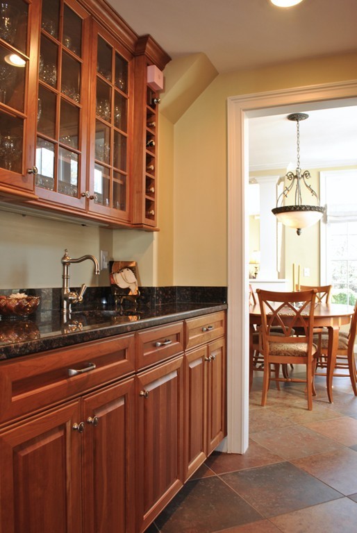 119 Crescent Road Concord, MA 01742 - Photo 8 of 18 a kitchen with a sink cabinets and dining table chair