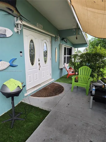 a view of a porch with furniture