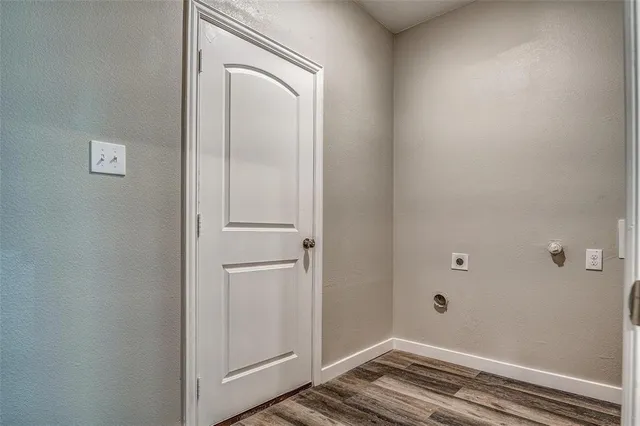 a view of a livingroom with wooden floor and closet
