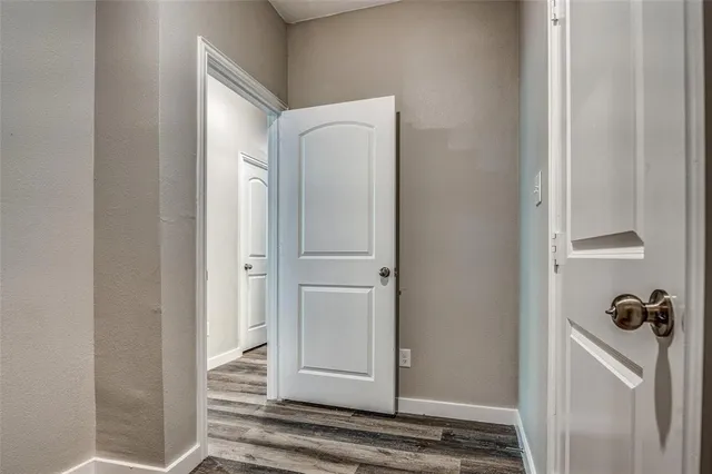a bathroom with a granite countertop sink mirror vanity and toilet