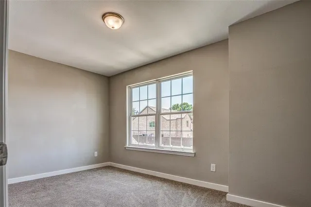 a view of an empty room and closet area