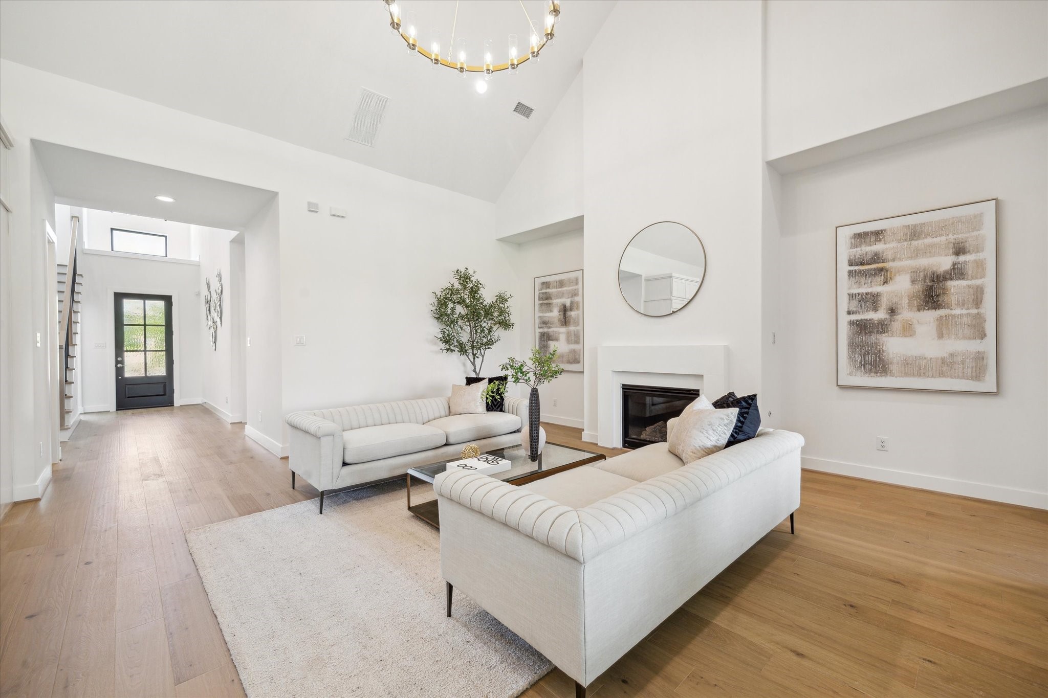 403 Venado View Court Conroe, TX 77304 - Photo 3 of 44 Welcome home! The Living Area has high, sloped ceiling with on-trend light fixtures, and gas log fireplace.