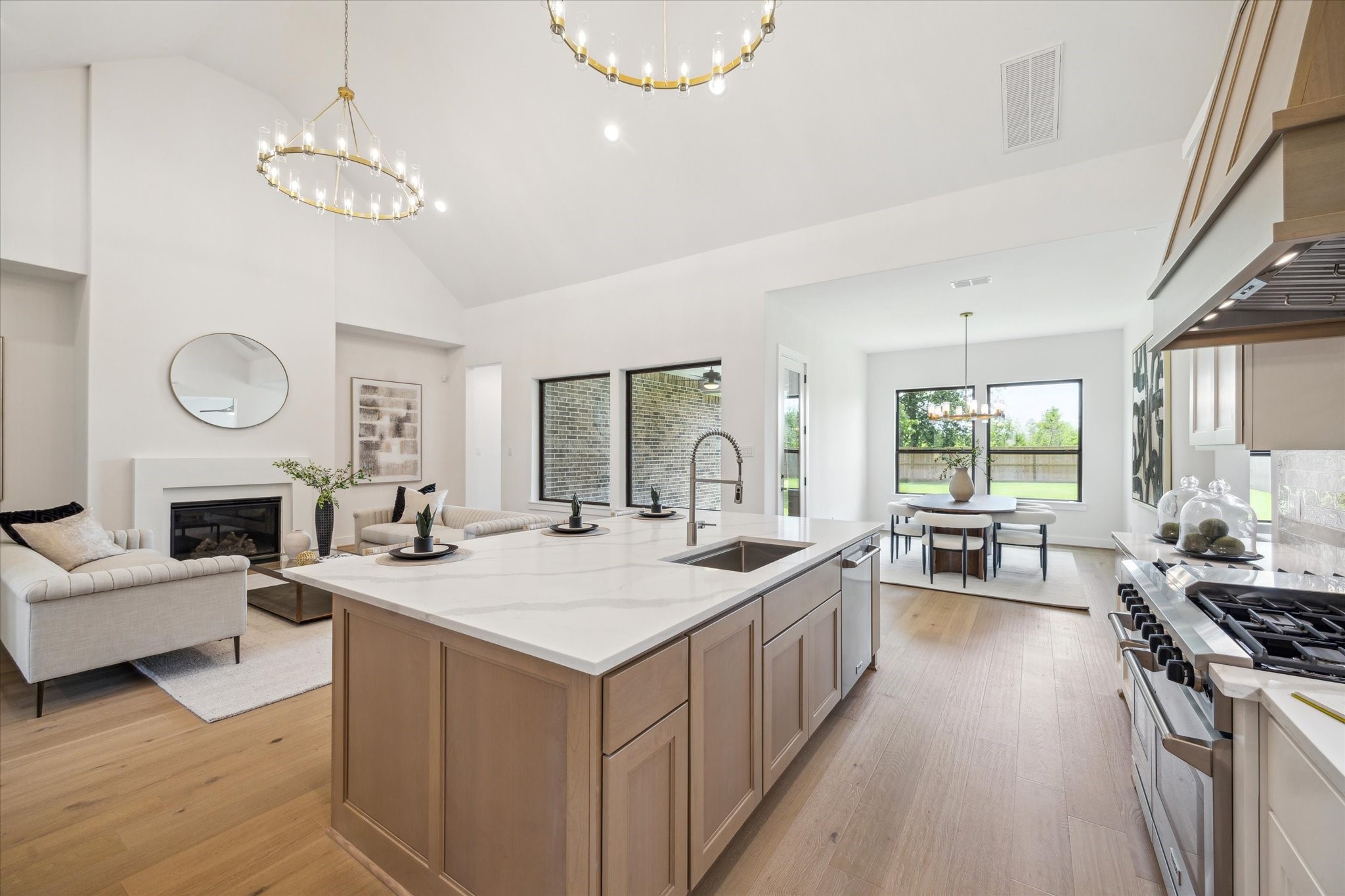 403 Venado View Court Conroe, TX 77304 - Photo 8 of 44 Harminous flow between Kitchen, Living, and Dining Areas