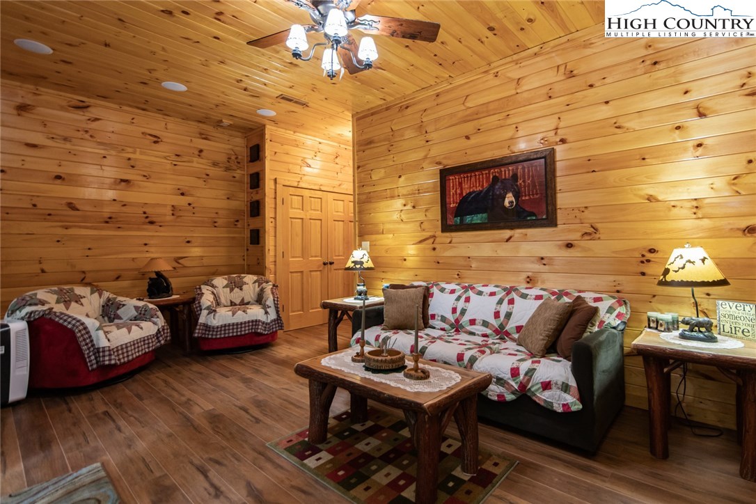 605 Wolf Pen Road Purlear, NC 28665 - Photo 39 of 50 a living room with furniture and a flat screen tv