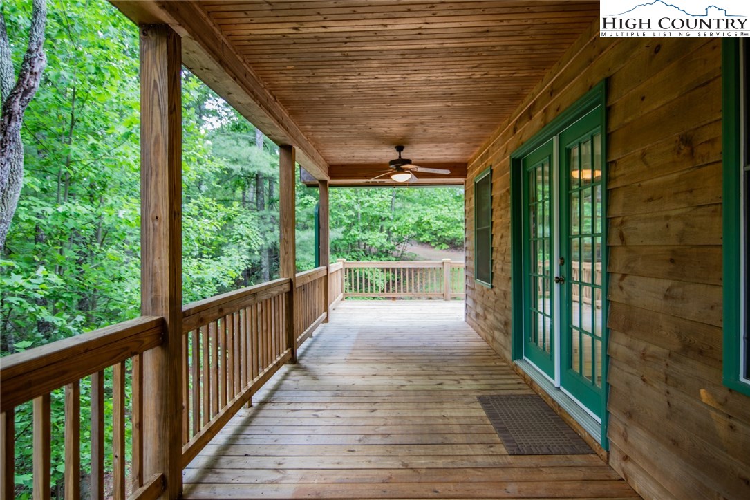 605 Wolf Pen Road Purlear, NC 28665 - Photo 5 of 50 a view of a porch with wooden floor and outdoor space