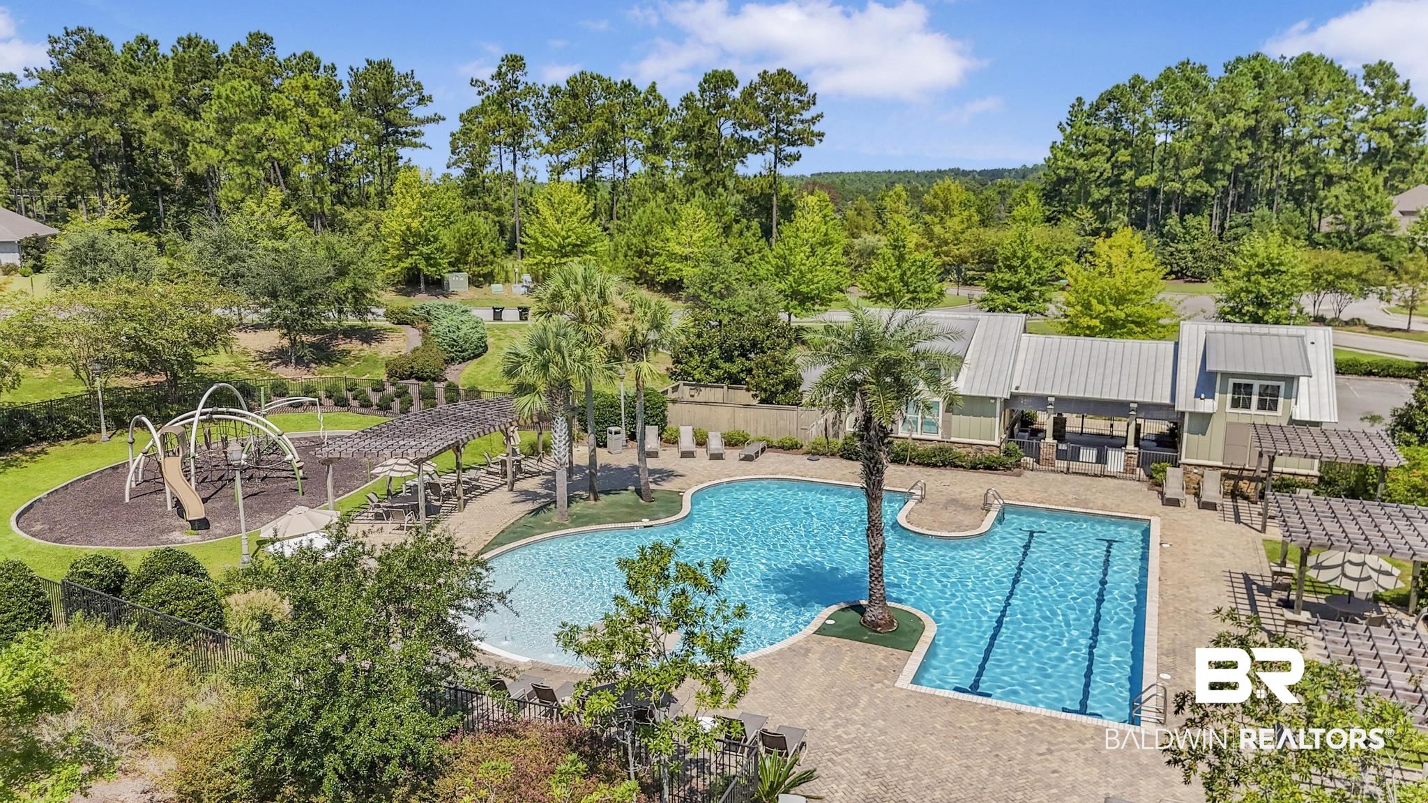 31336 Hoot Owl Road Daphne, AL 36527 - Photo 35 of 36 Community pool featuring a patio area