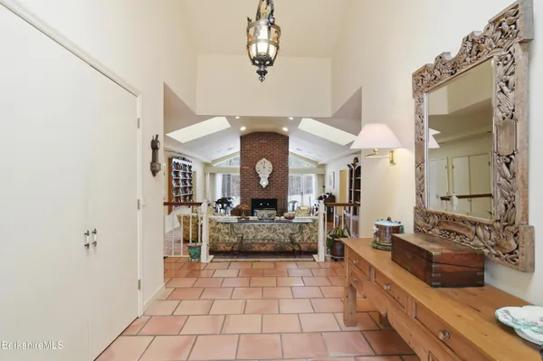 a living room with furniture and a book shelf