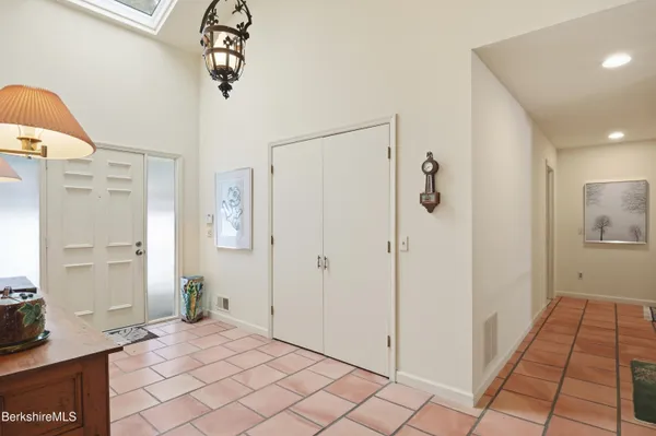 a view of a dining room with furniture and a rug