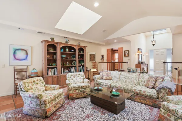 a kitchen with stainless steel appliances granite countertop a sink and a refrigerator