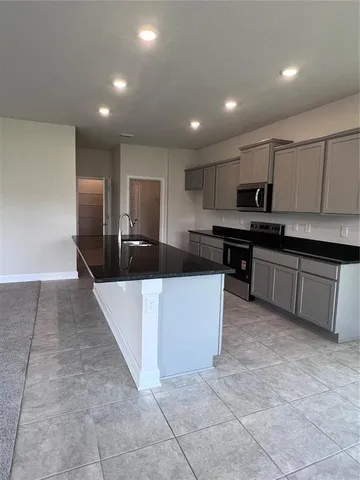 a large kitchen with cabinets