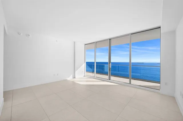a bathroom with a tub sink shower and mirror