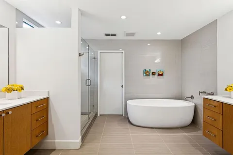 a bathroom with a tub and shower