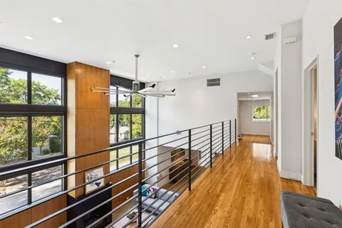 a view of balcony with wooden floor