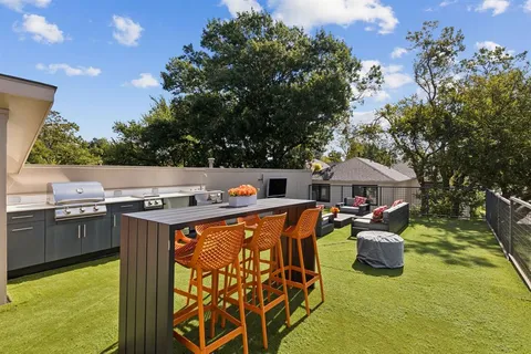 a view of a house with a sink and a yard