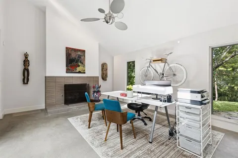 a view of a livingroom with furniture and a fireplace