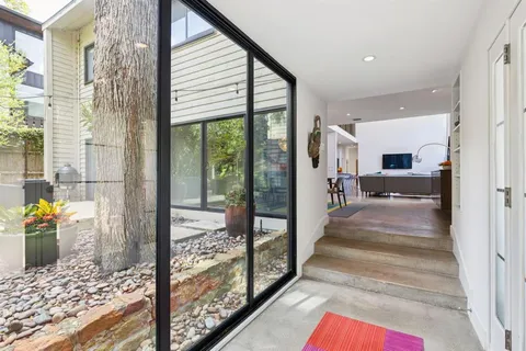 a view of a hallway view with staircase