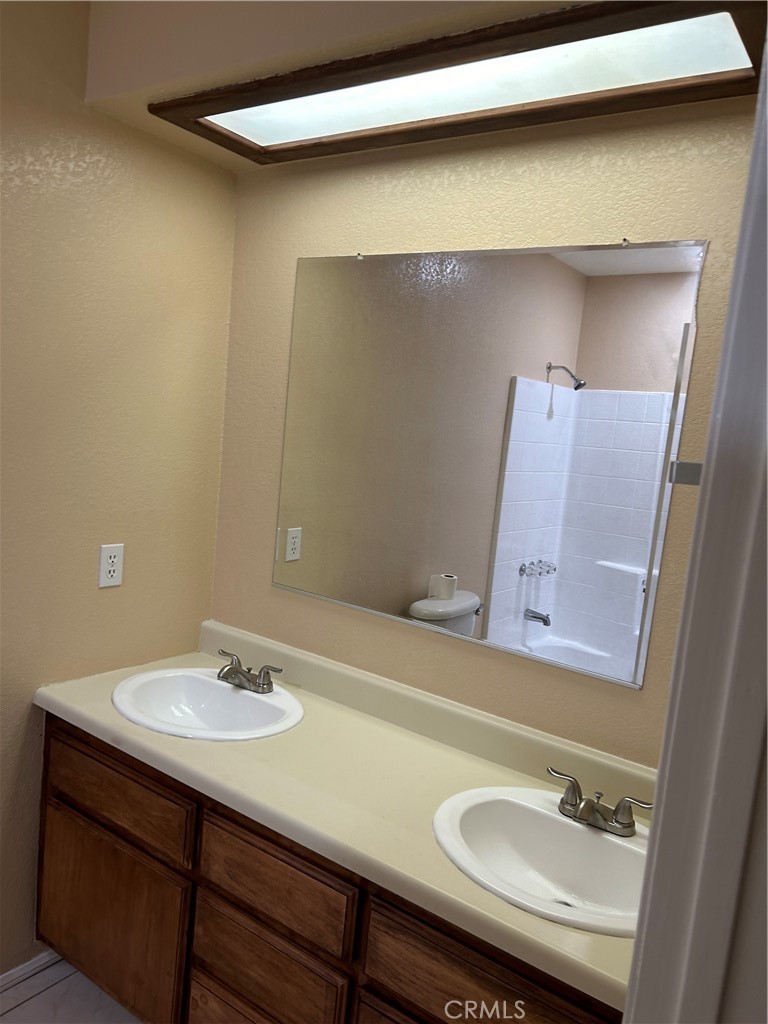58481 Del Mar Street Yucca Valley, CA 92284 - Photo 12 of 29 a bathroom with a sink and a mirror