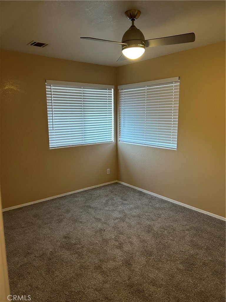 58481 Del Mar Street Yucca Valley, CA 92284 - Photo 18 of 29 a view of an empty room with a window