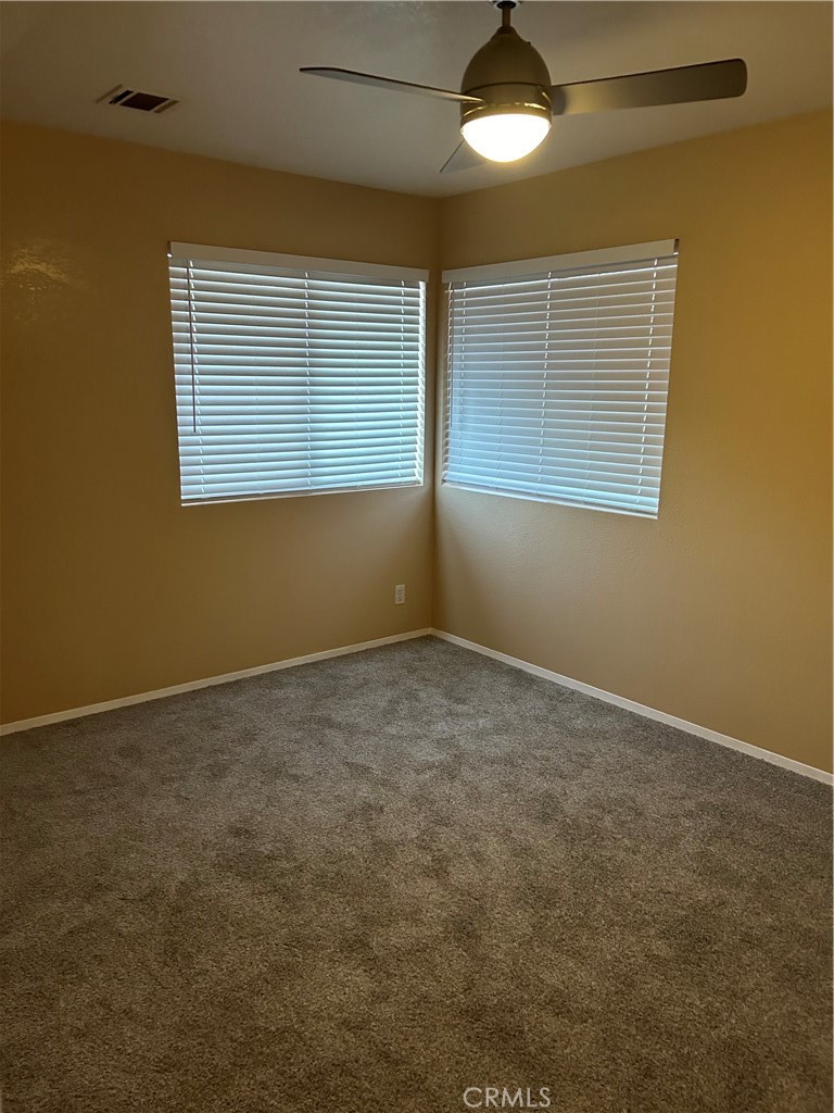 58481 Del Mar Street Yucca Valley, CA 92284 - Photo 19 of 29 a view of an empty room with a window