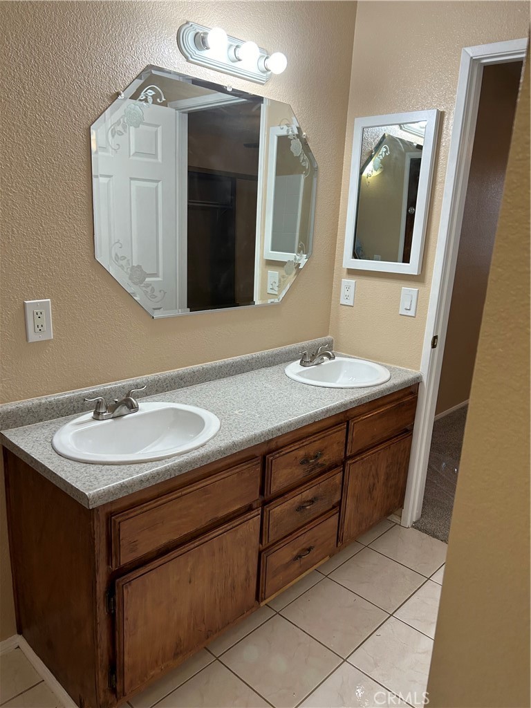 58481 Del Mar Street Yucca Valley, CA 92284 - Photo 24 of 29 a bathroom with a sink and a mirror