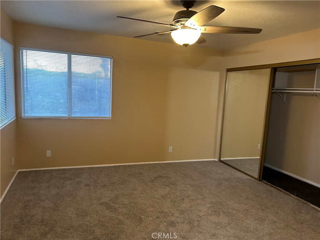 58481 Del Mar Street Yucca Valley, CA 92284 - Photo 26 of 29 an empty room with closet and windows
