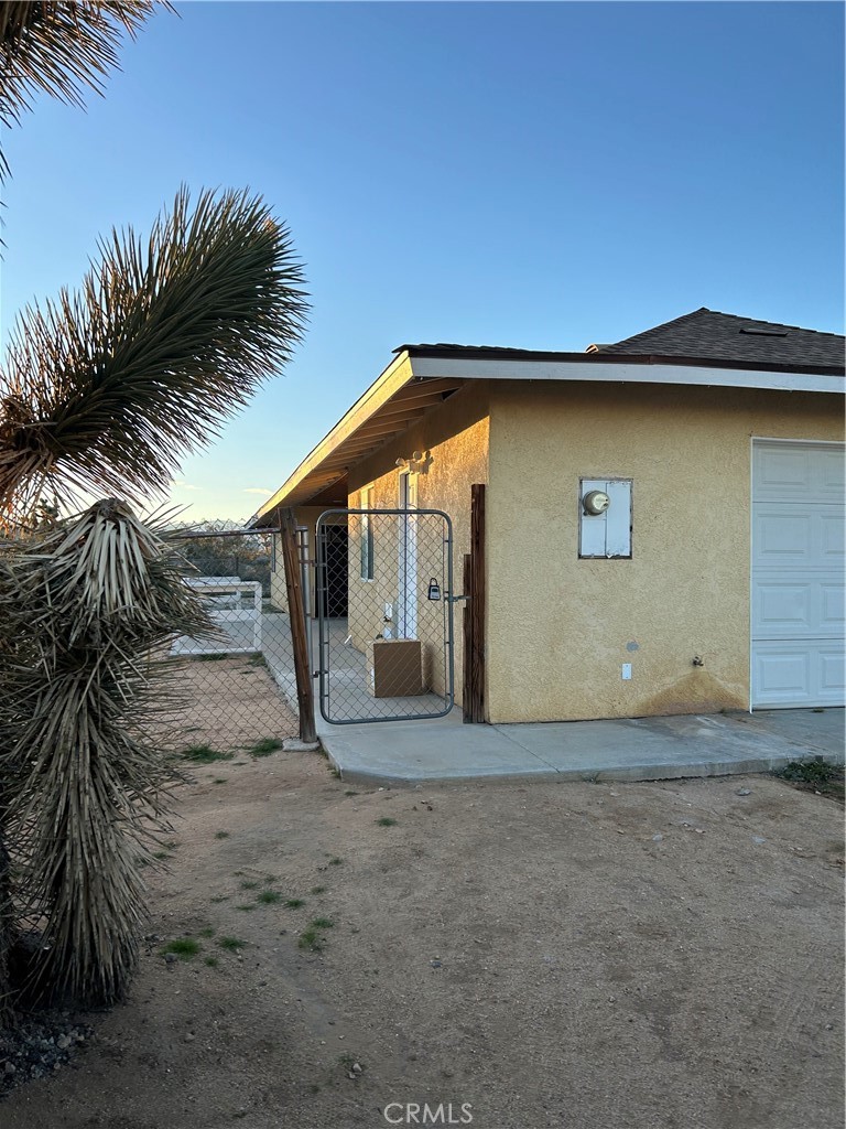58481 Del Mar Street Yucca Valley, CA 92284 - Photo 29 of 29 a view of a house with a yard