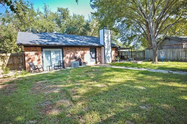 a backyard of a house with lots of green space