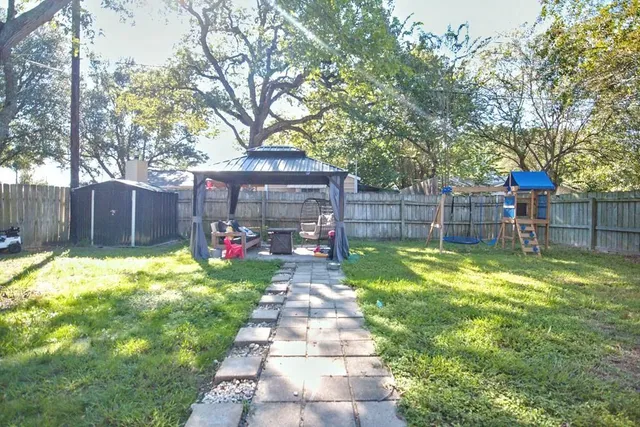 a view of a backyard with a garden