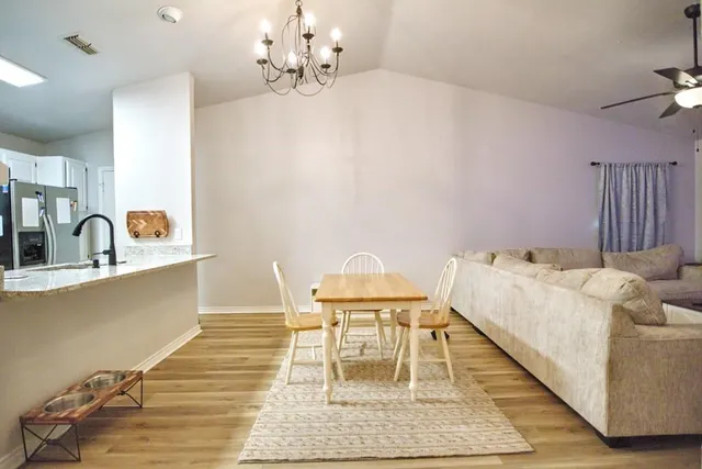 a living room with furniture and a table