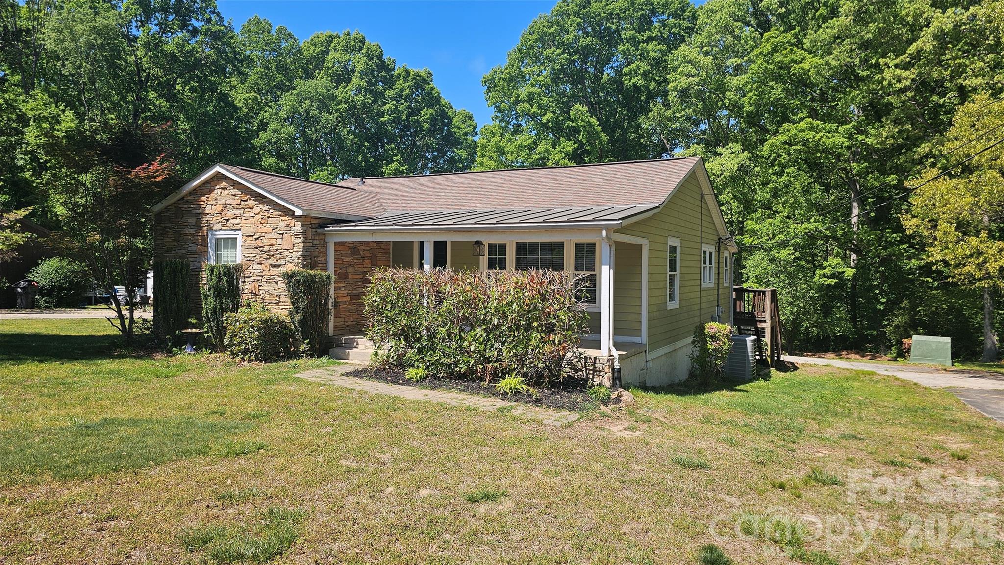 130 Pine State Road Troutman, NC 28166 - Photo 1 of 21 a view of a house with backyard and sitting area