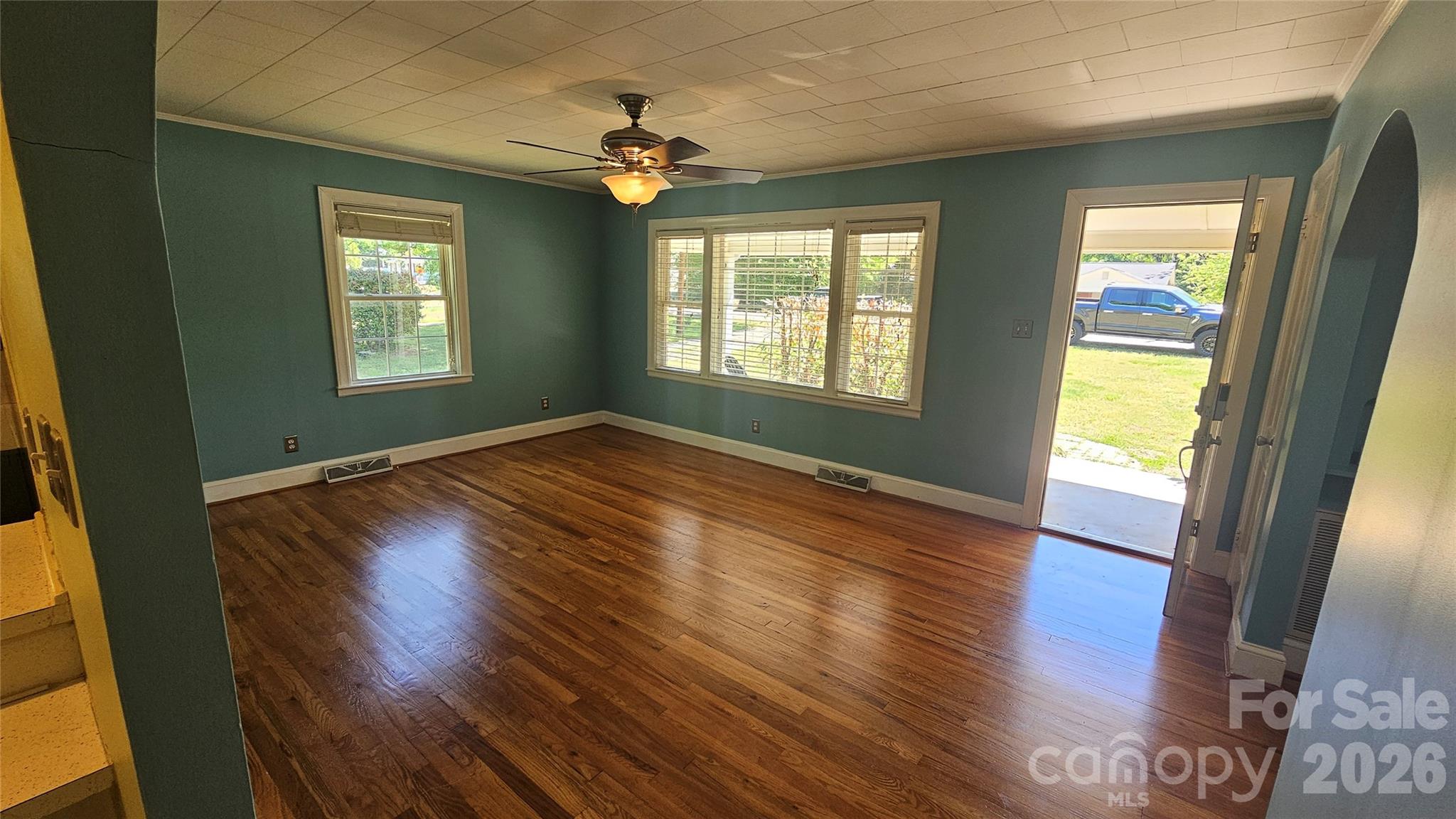 130 Pine State Road Troutman, NC 28166 - Photo 11 of 21 a view of an empty room with wooden floor and a window