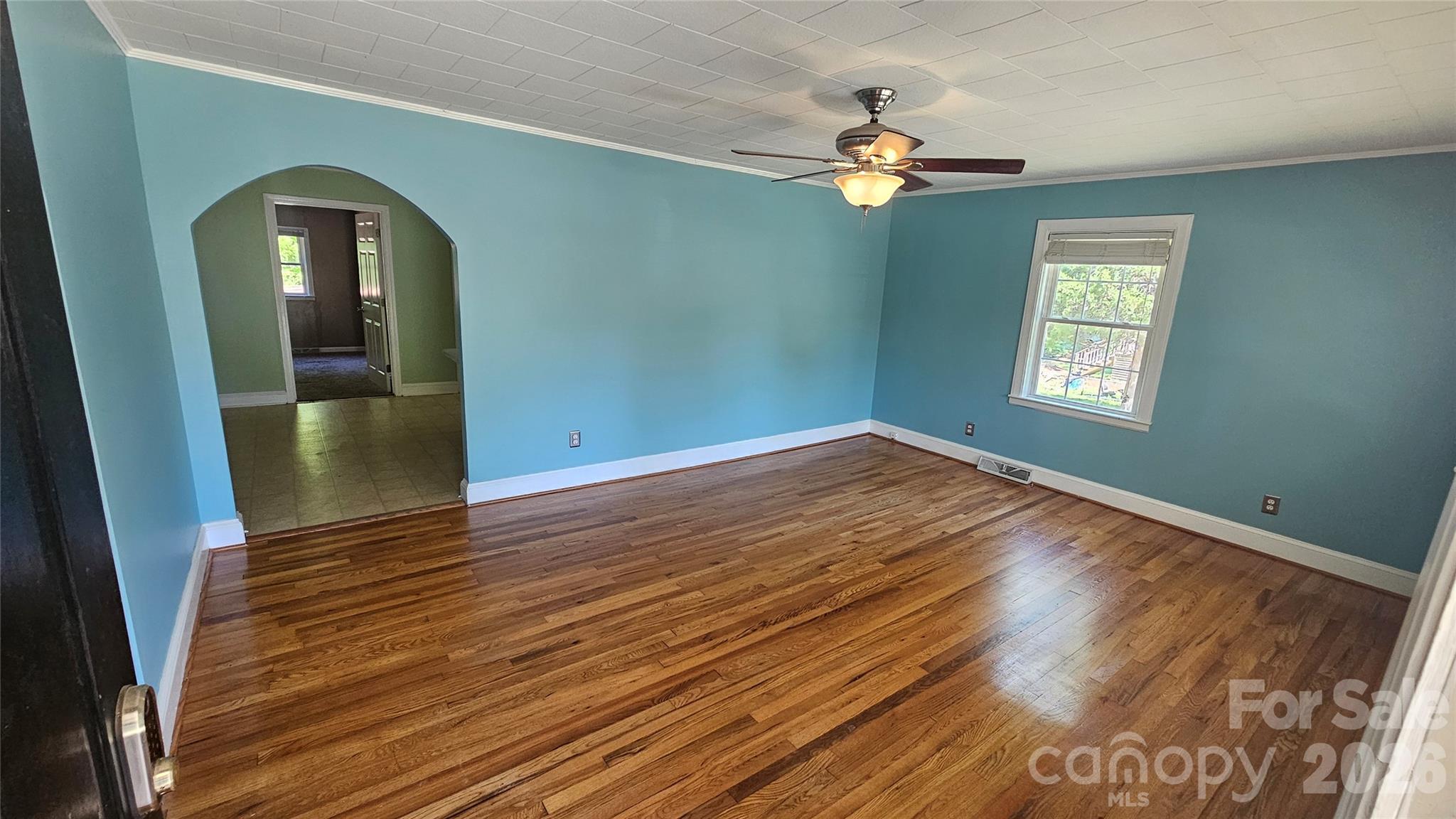130 Pine State Road Troutman, NC 28166 - Photo 12 of 21 wooden floor in an empty room with a window