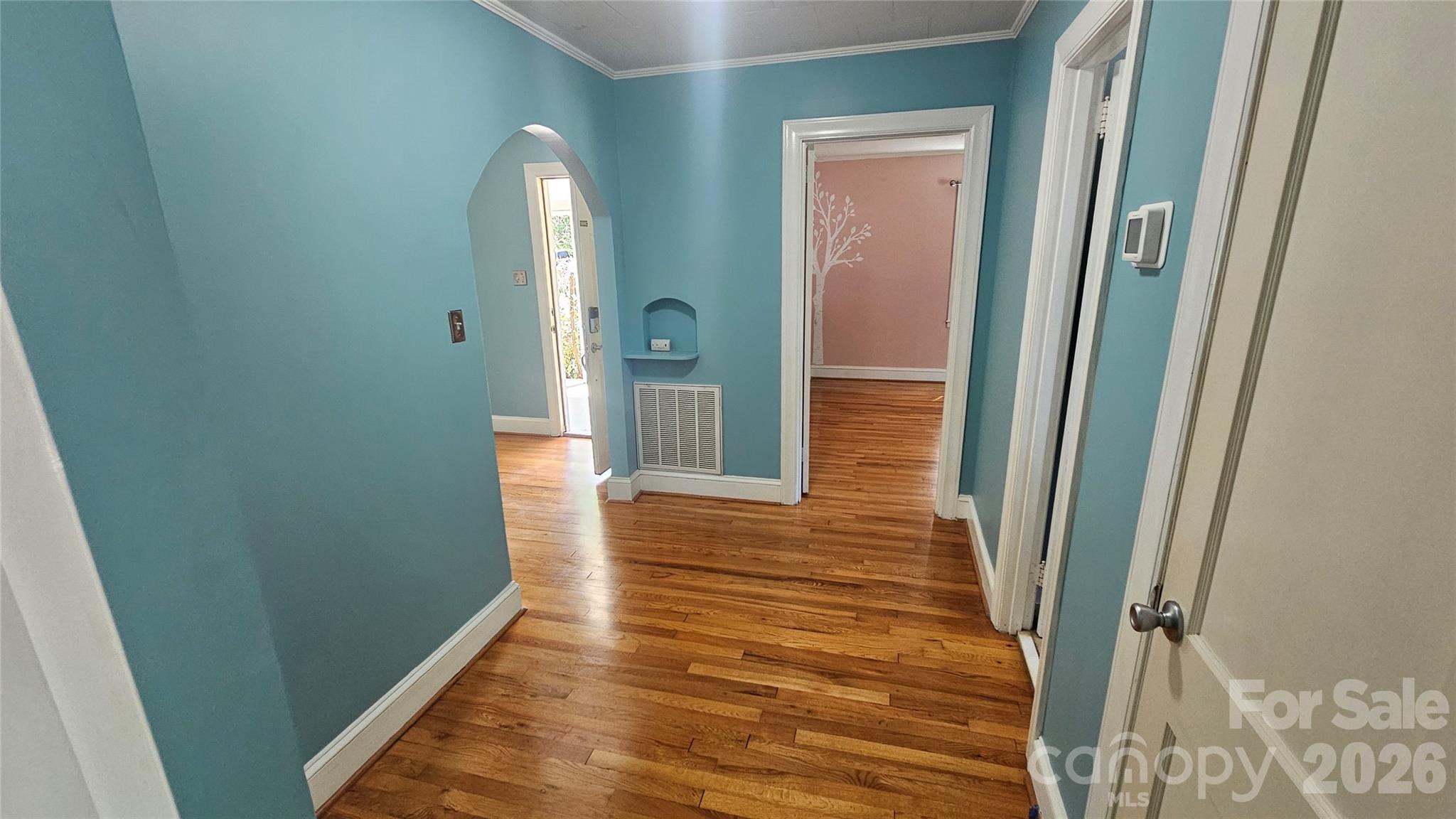 130 Pine State Road Troutman, NC 28166 - Photo 14 of 21 a view of a hallway with wooden floor and staircase