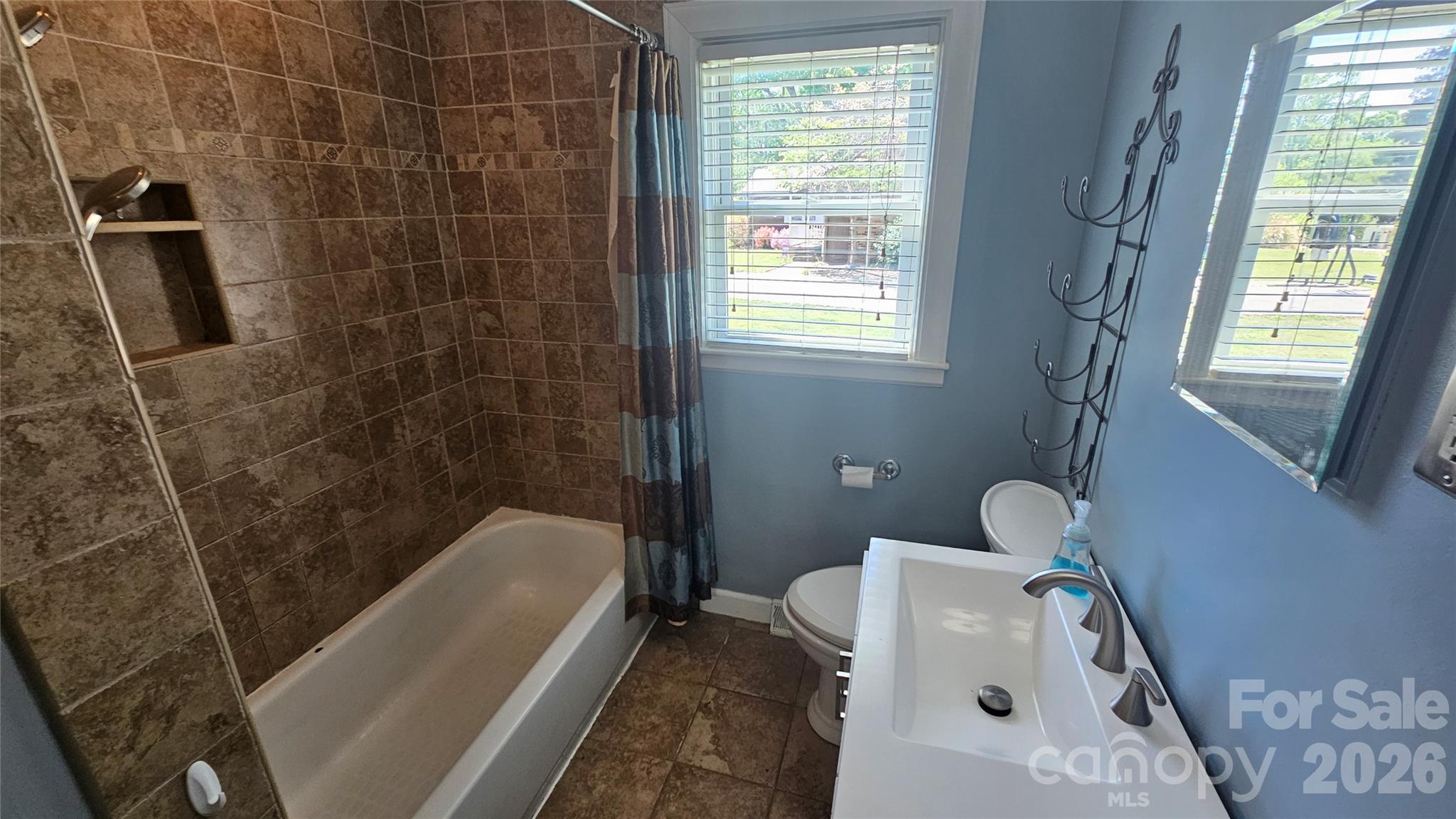 130 Pine State Road Troutman, NC 28166 - Photo 21 of 21 a bathroom with a tub a window and a shower
