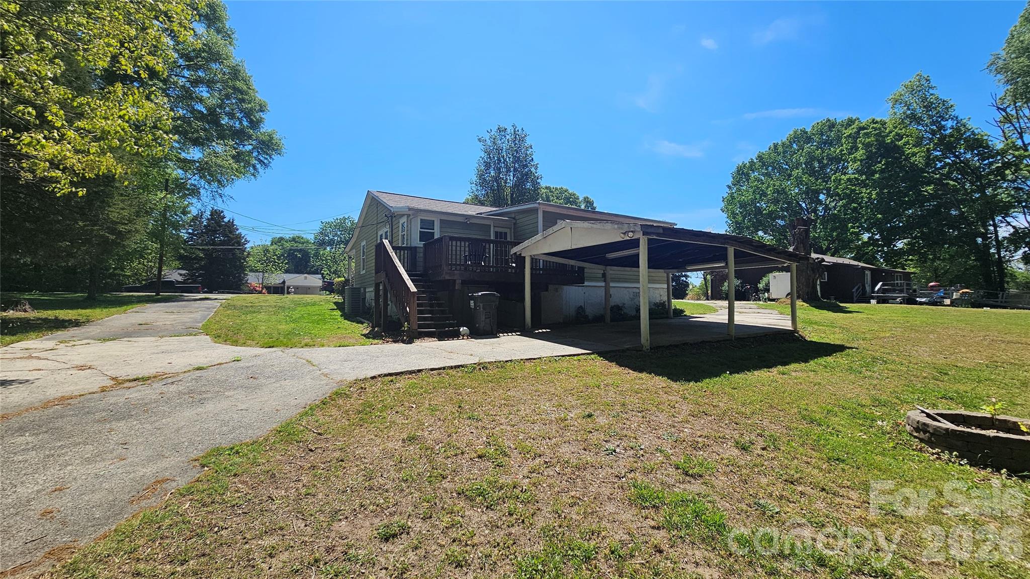 130 Pine State Road Troutman, NC 28166 - Photo 6 of 21 a view of a house with backyard and a tree