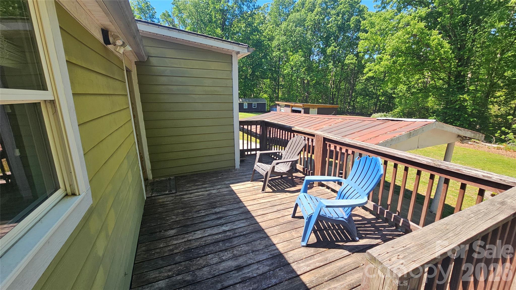 130 Pine State Road Troutman, NC 28166 - Photo 10 of 21 a view of balcony with wooden floor and outdoor seating